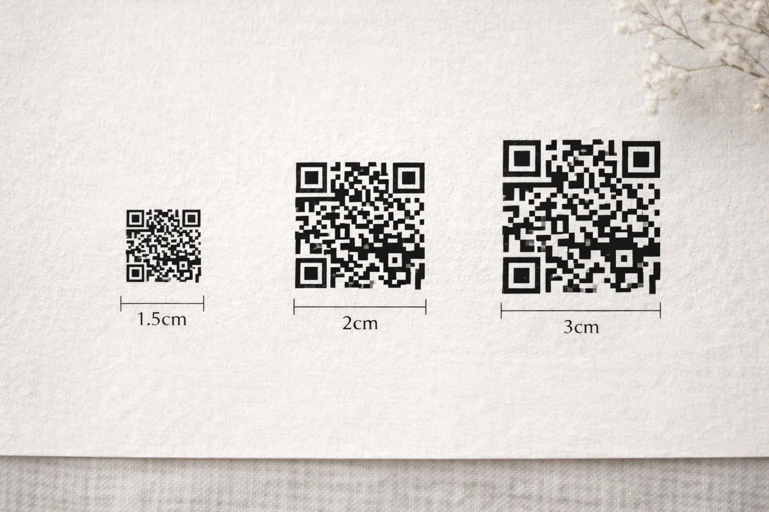QR code size comparison for wedding invitations showing 1.5cm, 2cm and recommended 3cm