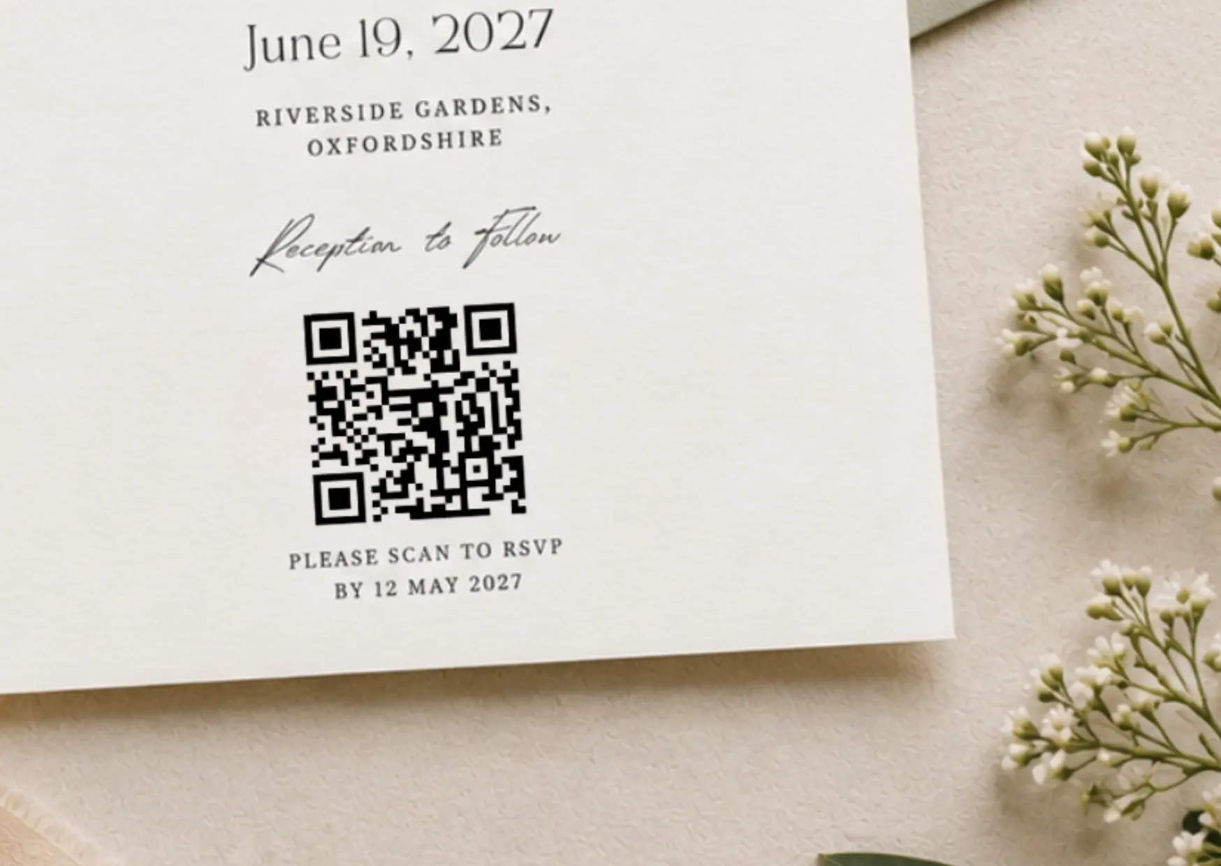 Close-up of wedding invitation wording with a QR code and Scan to RSVP text